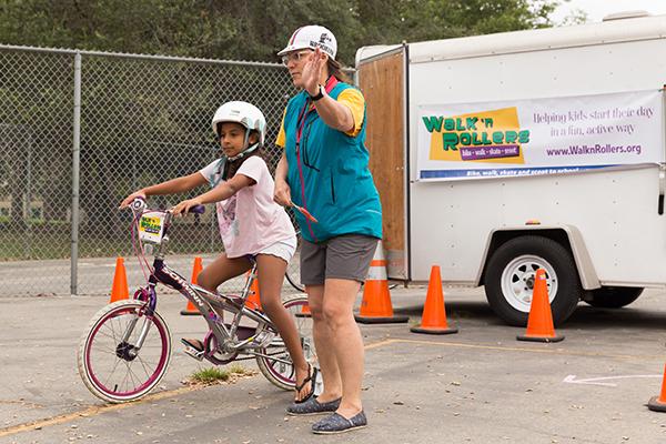 Child participating in an activity on bicycle