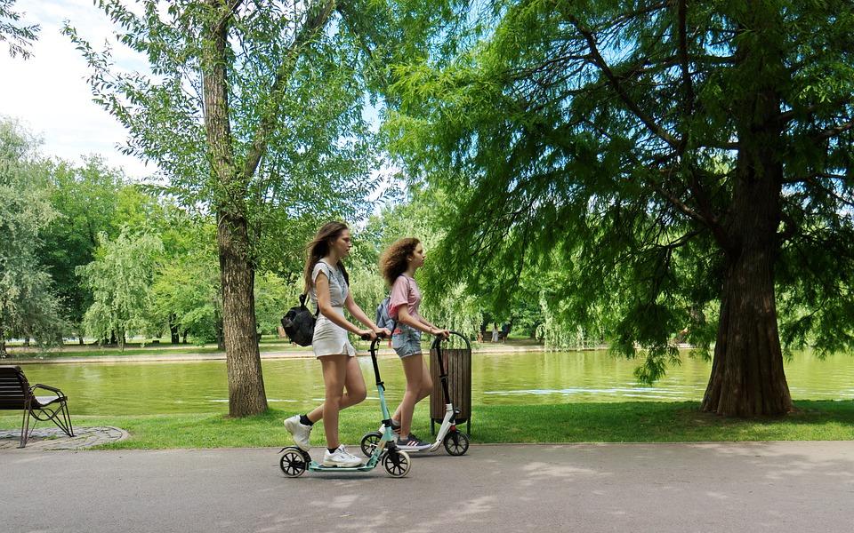 Image: Women riding scooters