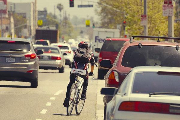 Bicyclist riding on the street in traffic